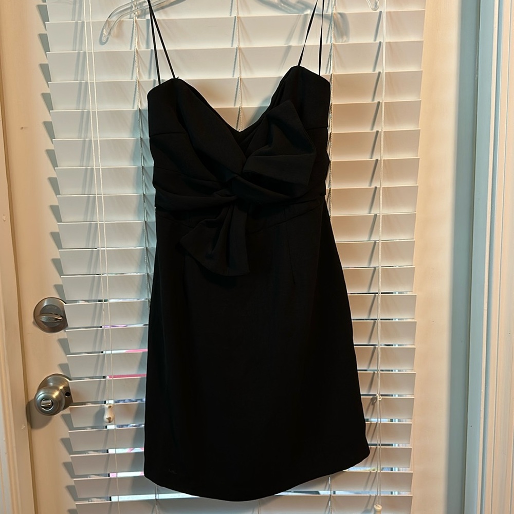 LITTLE BLACK STRAPLESS DRESS MEDIUM BY LUSH. BLACK BOW ON FRONT. ZIP BACK